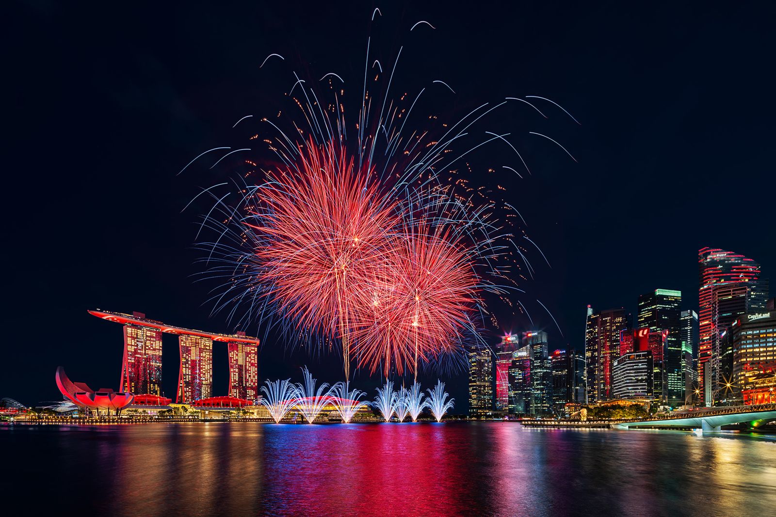 Single red burst over the Marina Bay skyline
