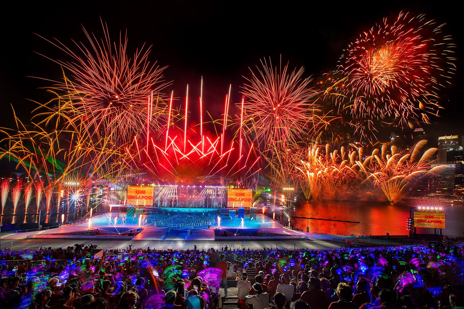 Orange fireworks over the National Day Parade grandstand